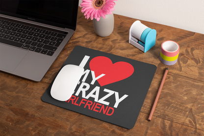 mockup-of-a-mousepad-lying-on-a-rustic-table-next-to-a-flower-vase-27554