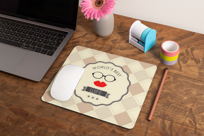 mockup-of-a-mousepad-lying-on-a-rustic-table-next-to-a-flower-vase-27554