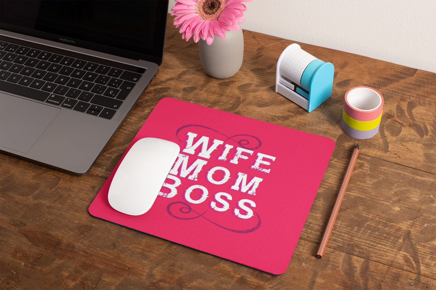 mockup-of-a-mousepad-lying-on-a-rustic-table-next-to-a-flower-vase-27554