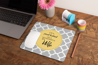 mockup-of-a-mousepad-lying-on-a-rustic-table-next-to-a-flower-vase-27554
