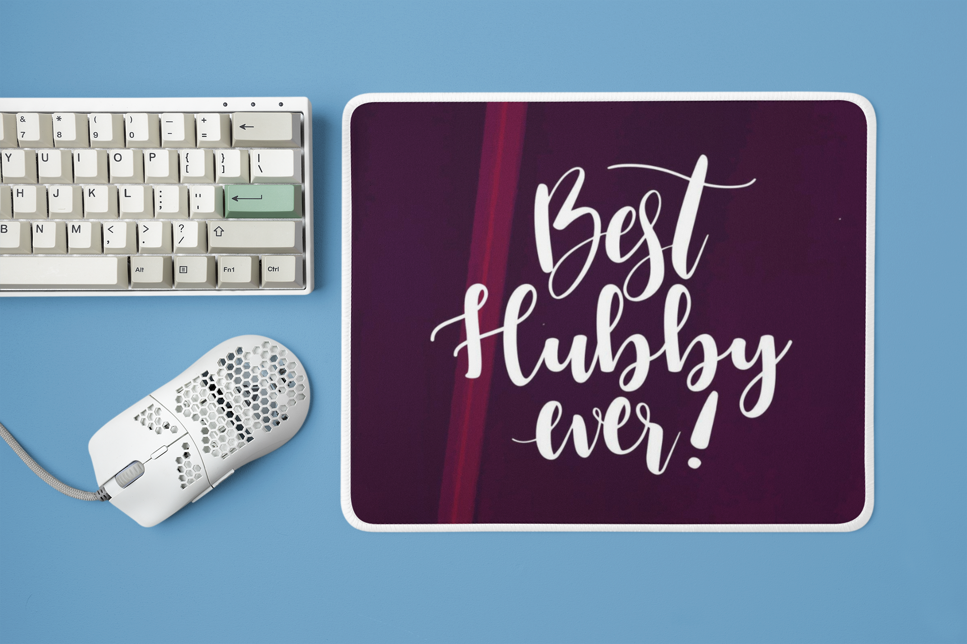 mockup-of-a-mousepad-placed-next-to-a-mechanical-keyboard-and-a-mouse-m23225