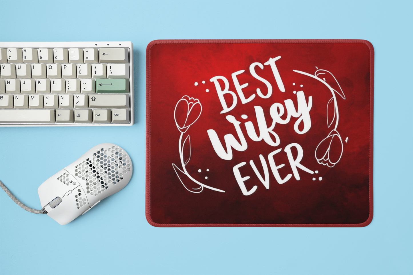 mockup-of-a-mousepad-placed-next-to-a-mechanical-keyboard-and-a-mouse-m23225