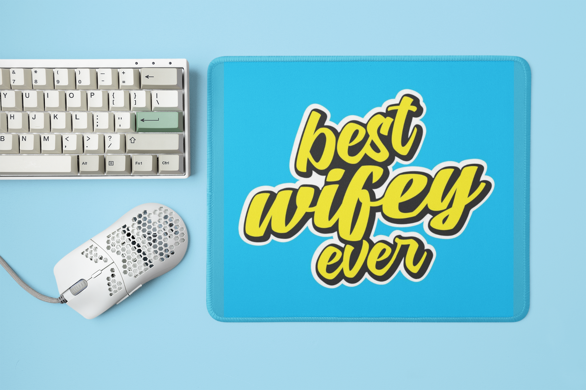 mockup-of-a-mousepad-placed-next-to-a-mechanical-keyboard-and-a-mouse-m23225