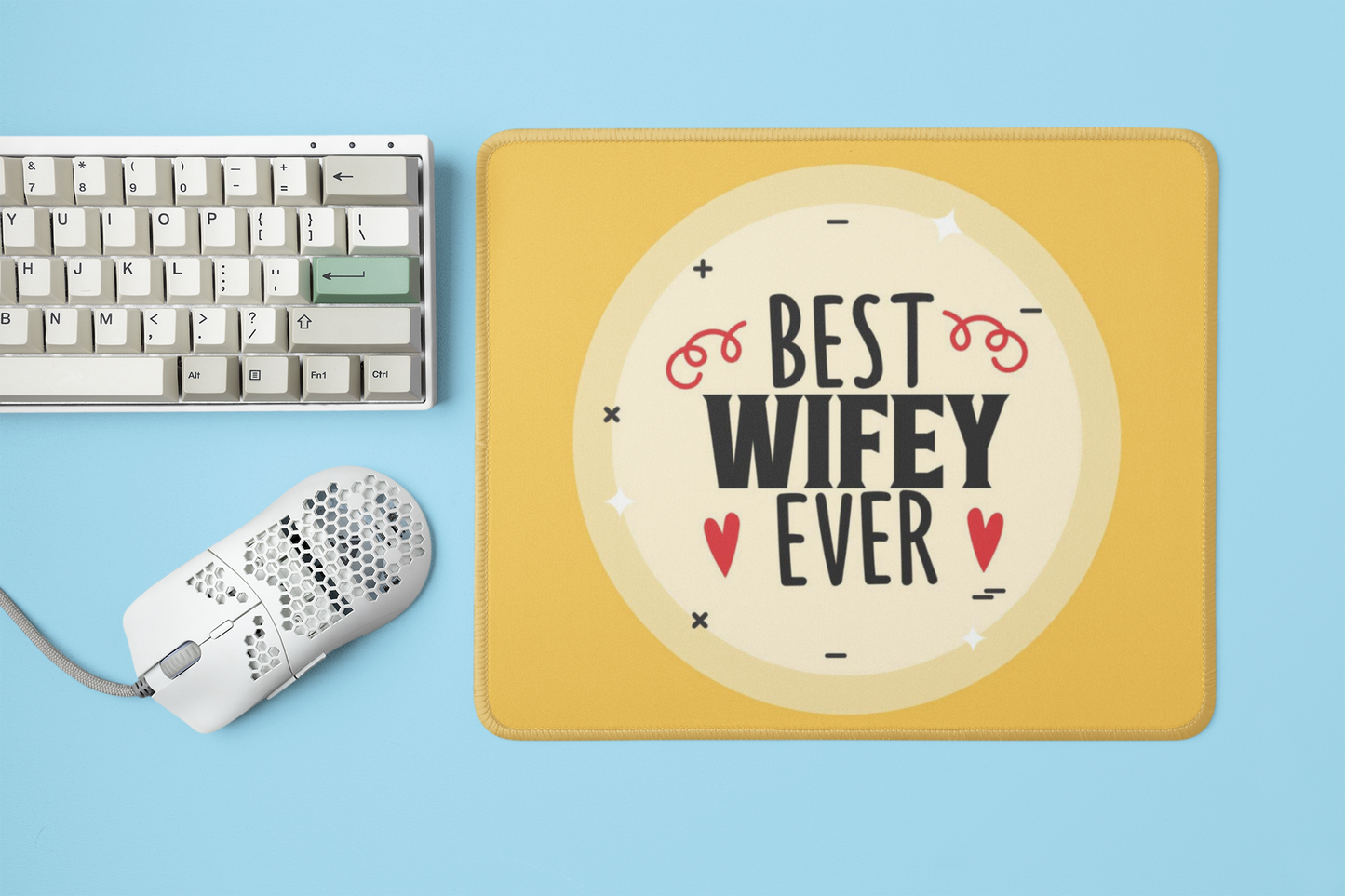 mockup-of-a-mousepad-placed-next-to-a-mechanical-keyboard-and-a-mouse-m23225