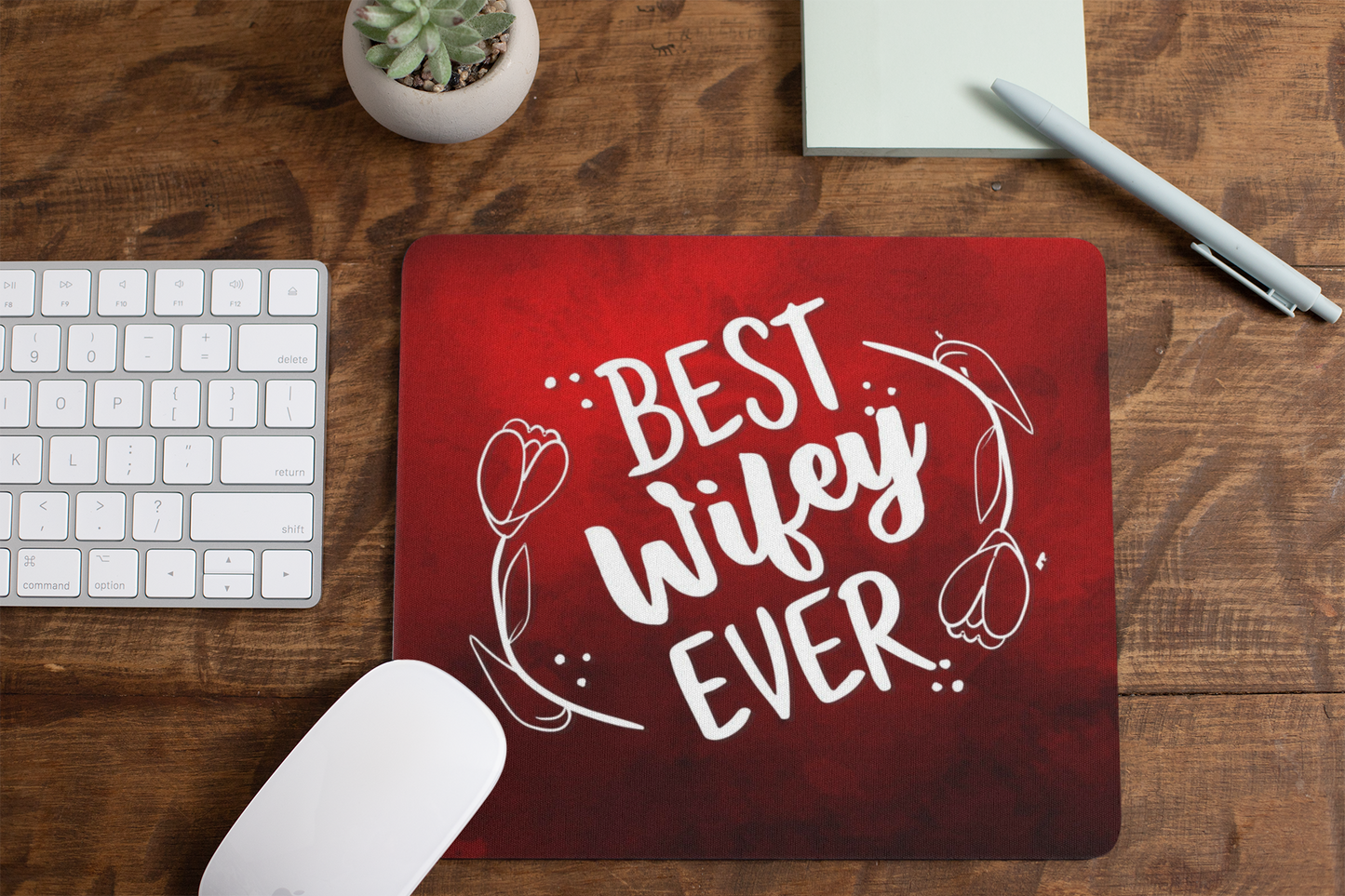 mousepad-mockup-lying-on-a-table-next-to-a-plant-pot-and-some-office-supplies-27553 (1)