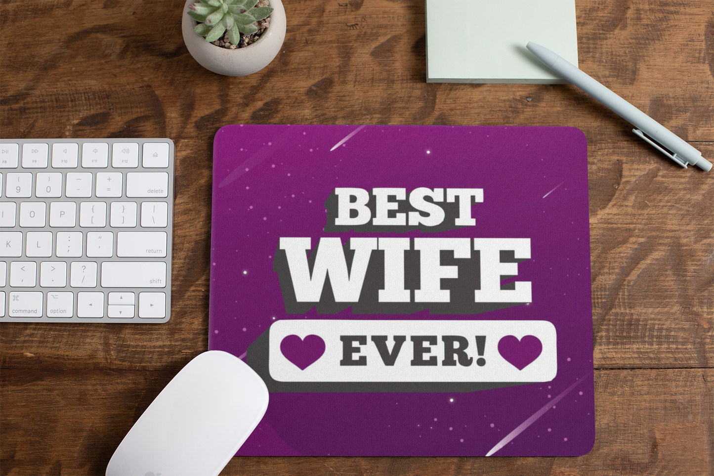 mousepad-mockup-lying-on-a-table-next-to-a-plant-pot-and-some-office-supplies-27553