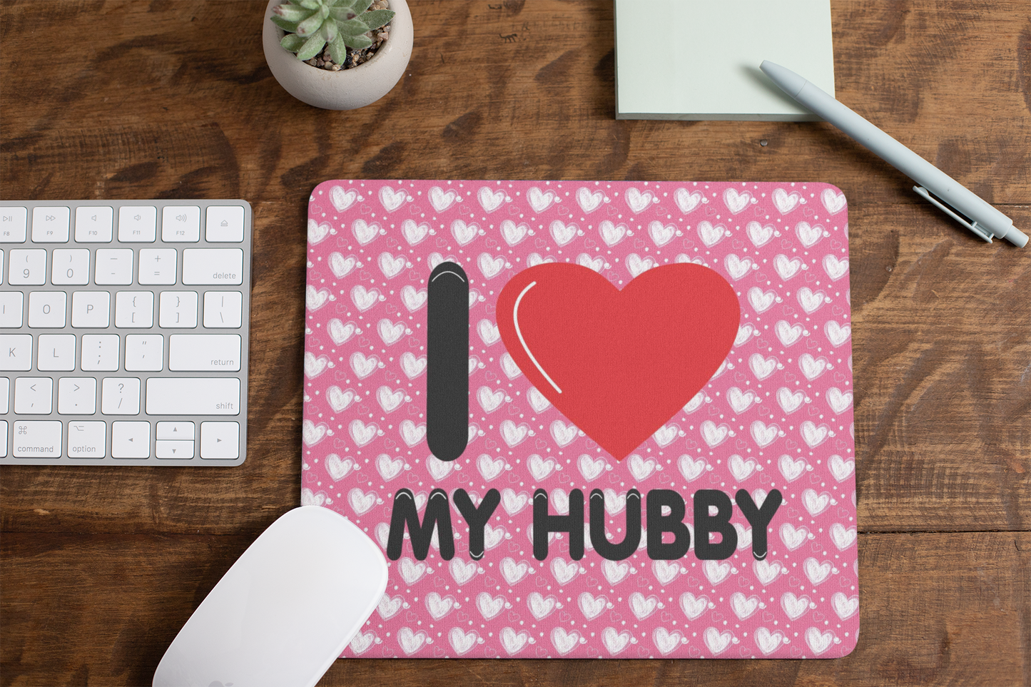 mousepad-mockup-lying-on-a-table-next-to-a-plant-pot-and-some-office-supplies-27553