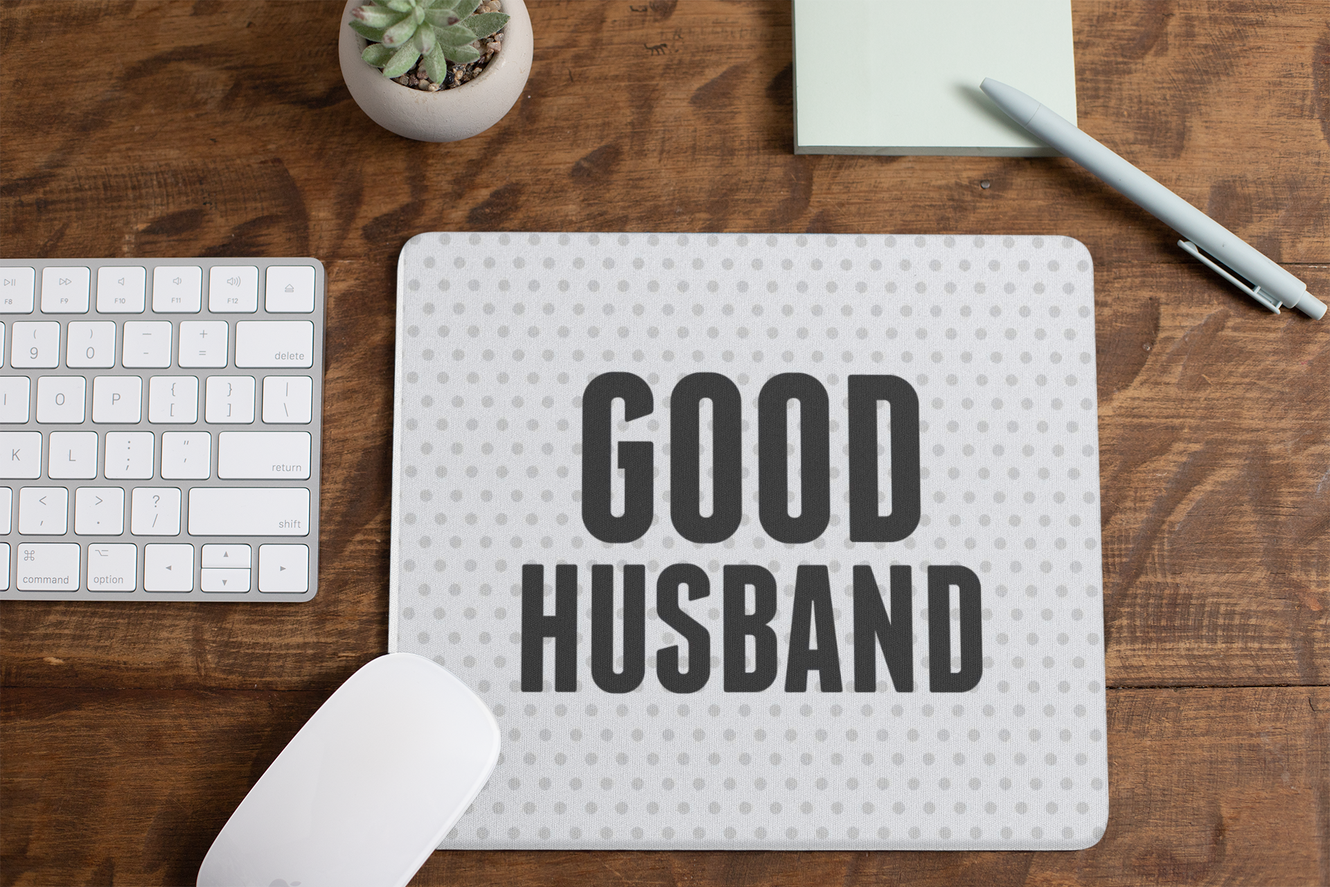 mousepad-mockup-lying-on-a-table-next-to-a-plant-pot-and-some-office-supplies-27553