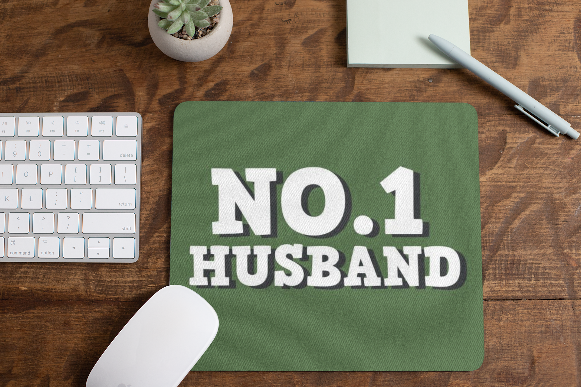mousepad-mockup-lying-on-a-table-next-to-a-plant-pot-and-some-office-supplies-27553