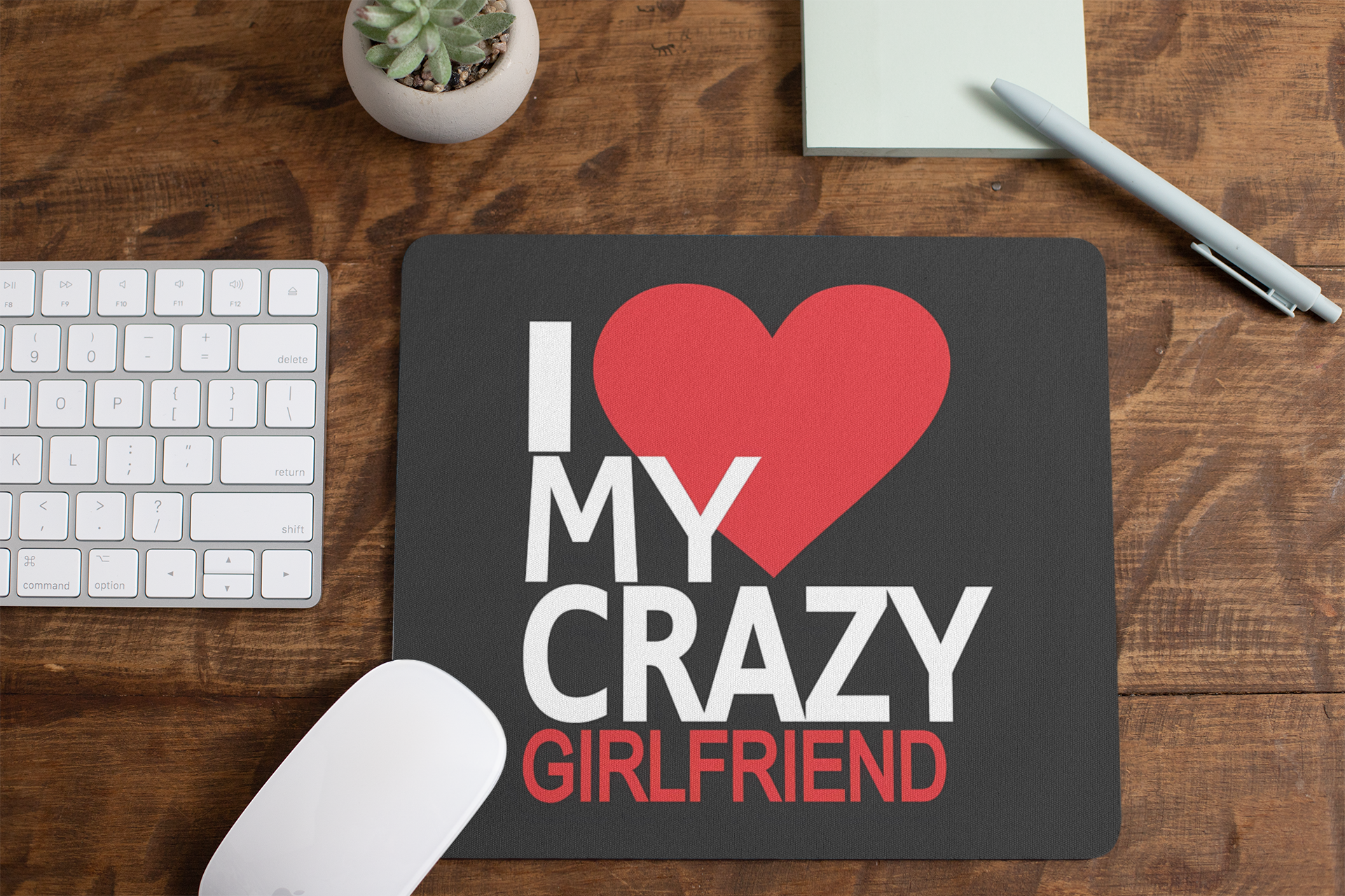 mousepad-mockup-lying-on-a-table-next-to-a-plant-pot-and-some-office-supplies-27553