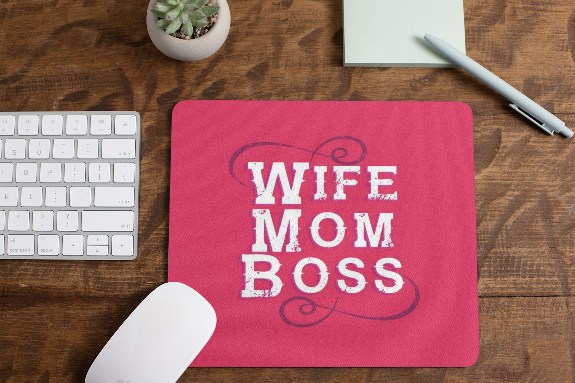 mousepad-mockup-lying-on-a-table-next-to-a-plant-pot-and-some-office-supplies-27553