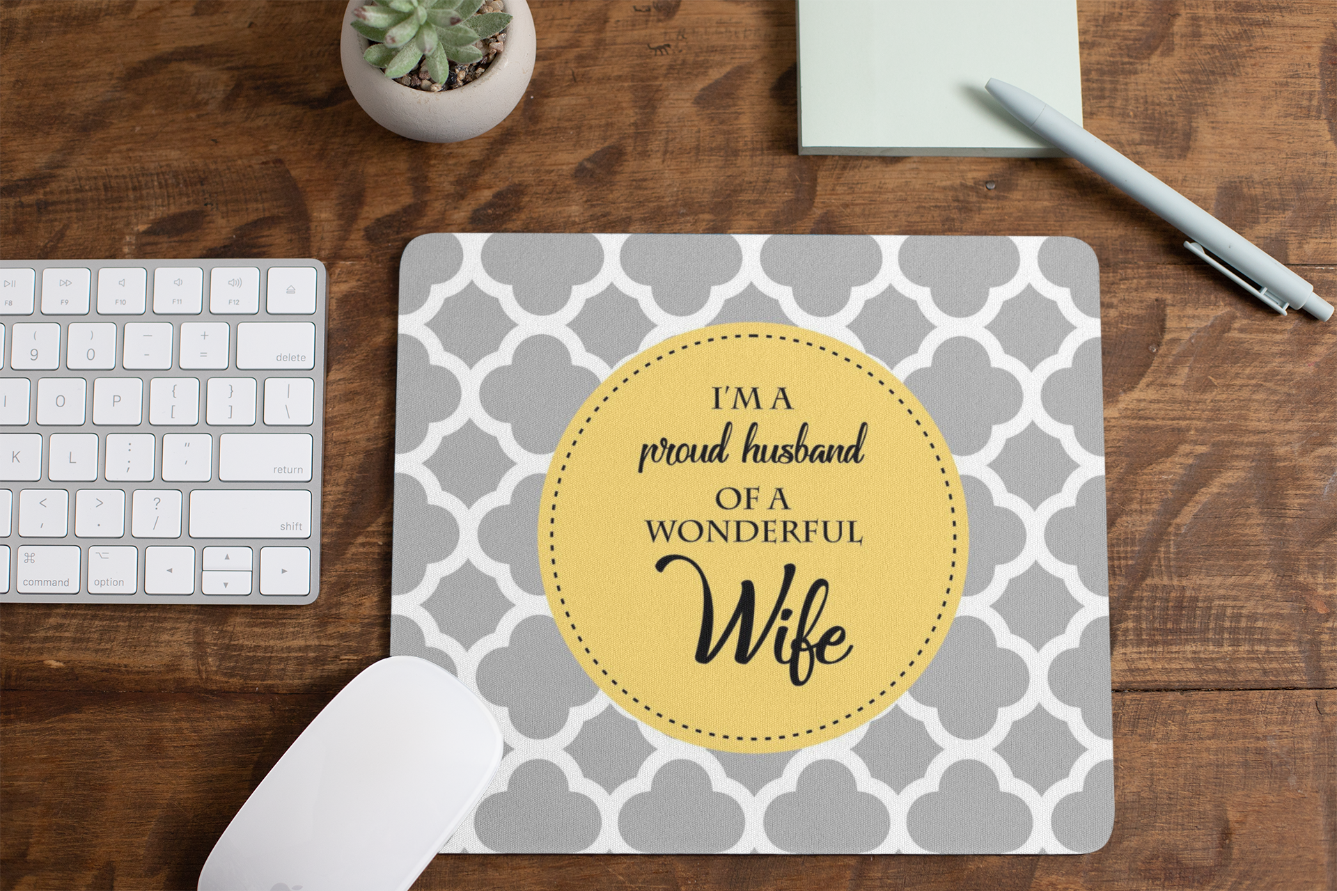 mousepad-mockup-lying-on-a-table-next-to-a-plant-pot-and-some-office-supplies-27553