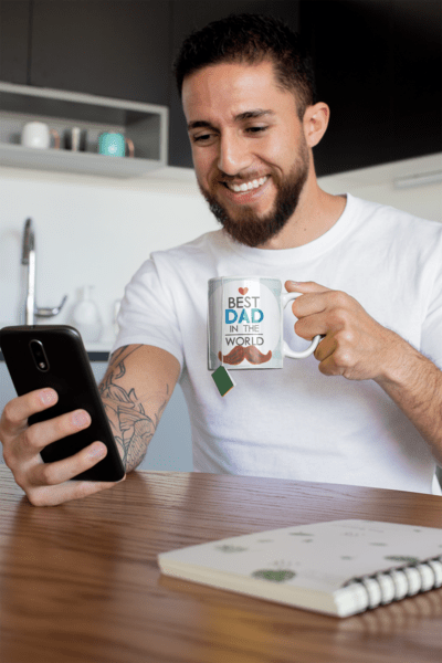 mug-mockup-of-a-tattooed-man-having-some-tea-at-home-24017-2-1