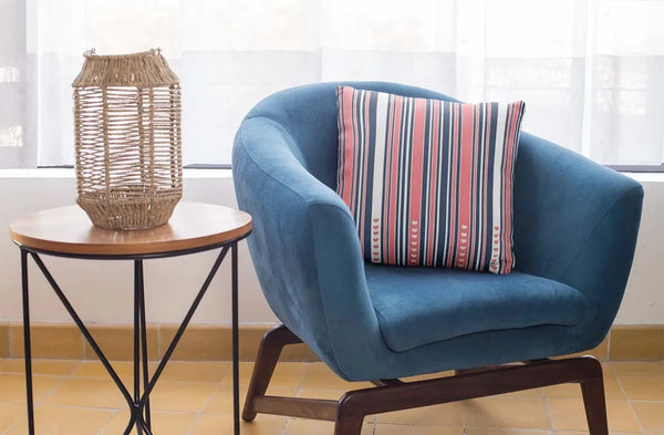 square-pillow-mockup-featuring-a-blue-single-sofa-29011