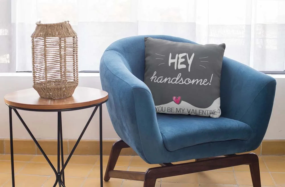 square-pillow-mockup-featuring-a-blue-single-sofa-29011
