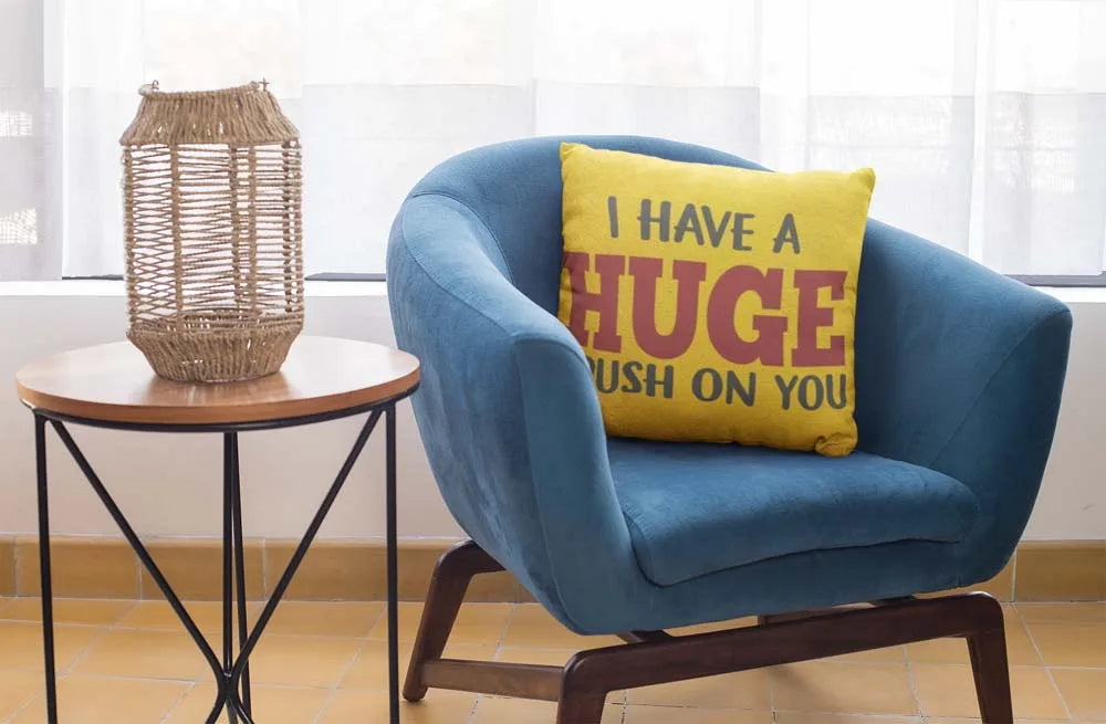 square-pillow-mockup-featuring-a-blue-single-sofa-29011