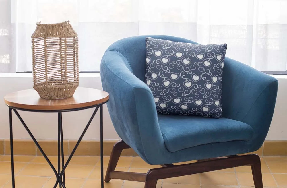 square-pillow-mockup-featuring-a-blue-single-sofa-29011