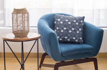 square-pillow-mockup-featuring-a-blue-single-sofa-29011