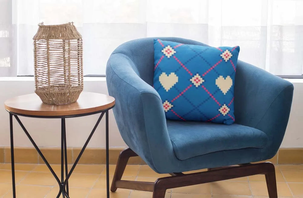 square-pillow-mockup-featuring-a-blue-single-sofa-29011