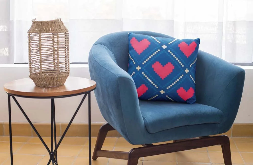 square-pillow-mockup-featuring-a-blue-single-sofa-29011