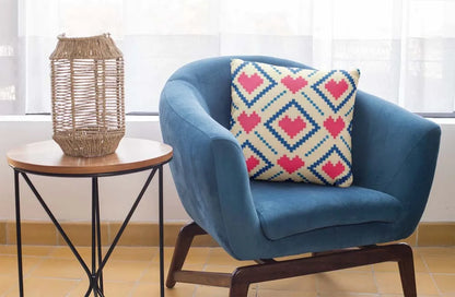 square-pillow-mockup-featuring-a-blue-single-sofa-29011