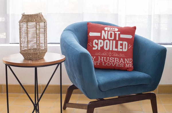 square-pillow-mockup-featuring-a-blue-single-sofa-29011