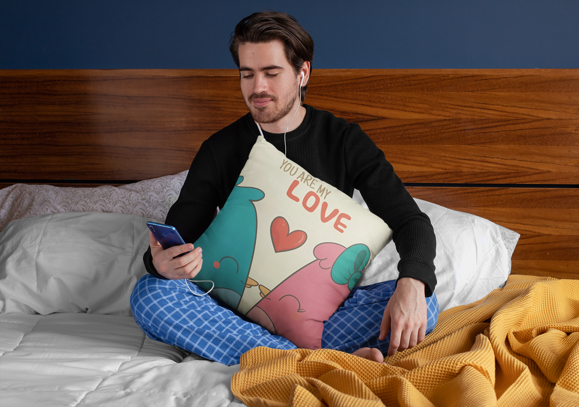 squared-pillow-mockup-featuring-a-man-sitting-over-a-bed-29023