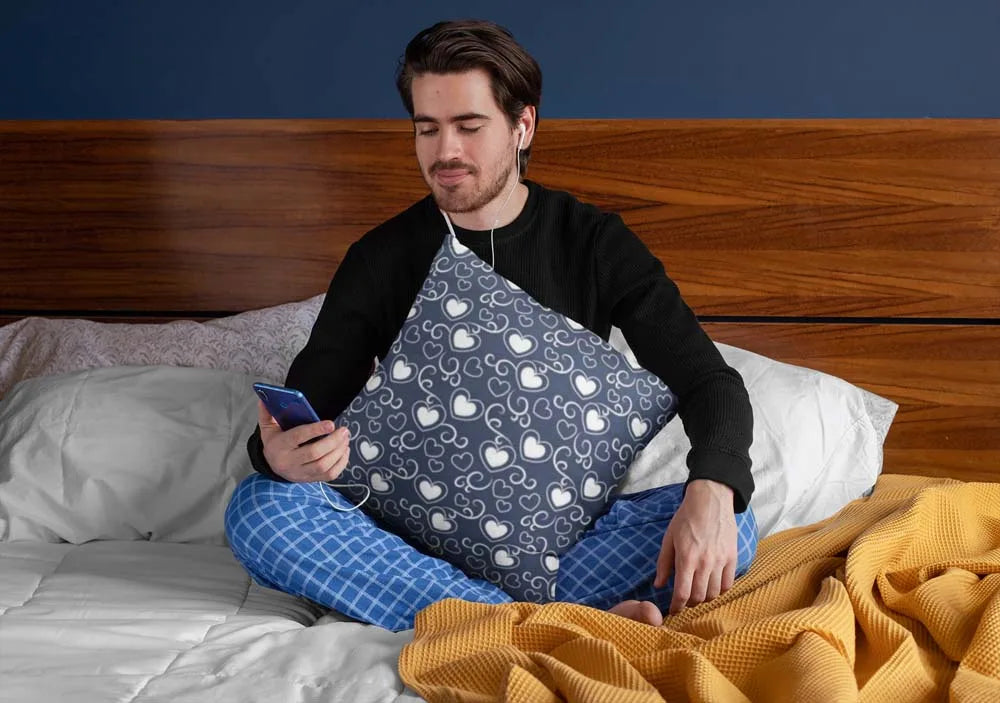squared-pillow-mockup-featuring-a-man-sitting-over-a-bed-29023