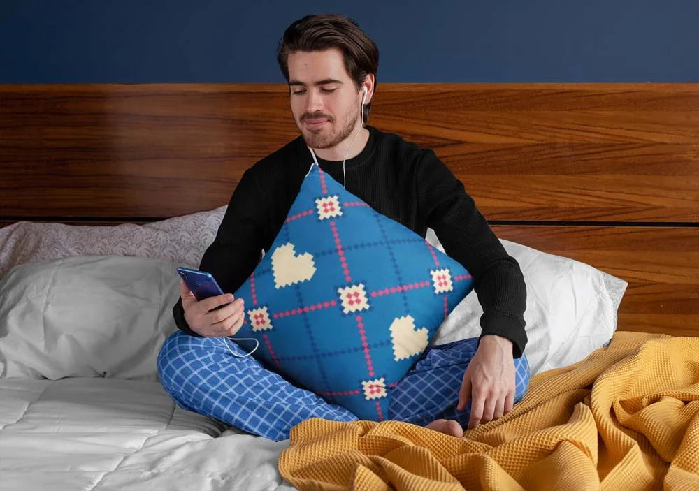 squared-pillow-mockup-featuring-a-man-sitting-over-a-bed-29023