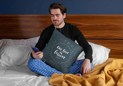 squared-pillow-mockup-featuring-a-man-sitting-over-a-bed-29023