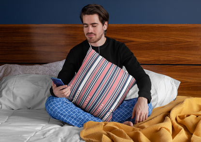 squared-pillow-mockup-featuring-a-man-sitting-over-a-bed-29023