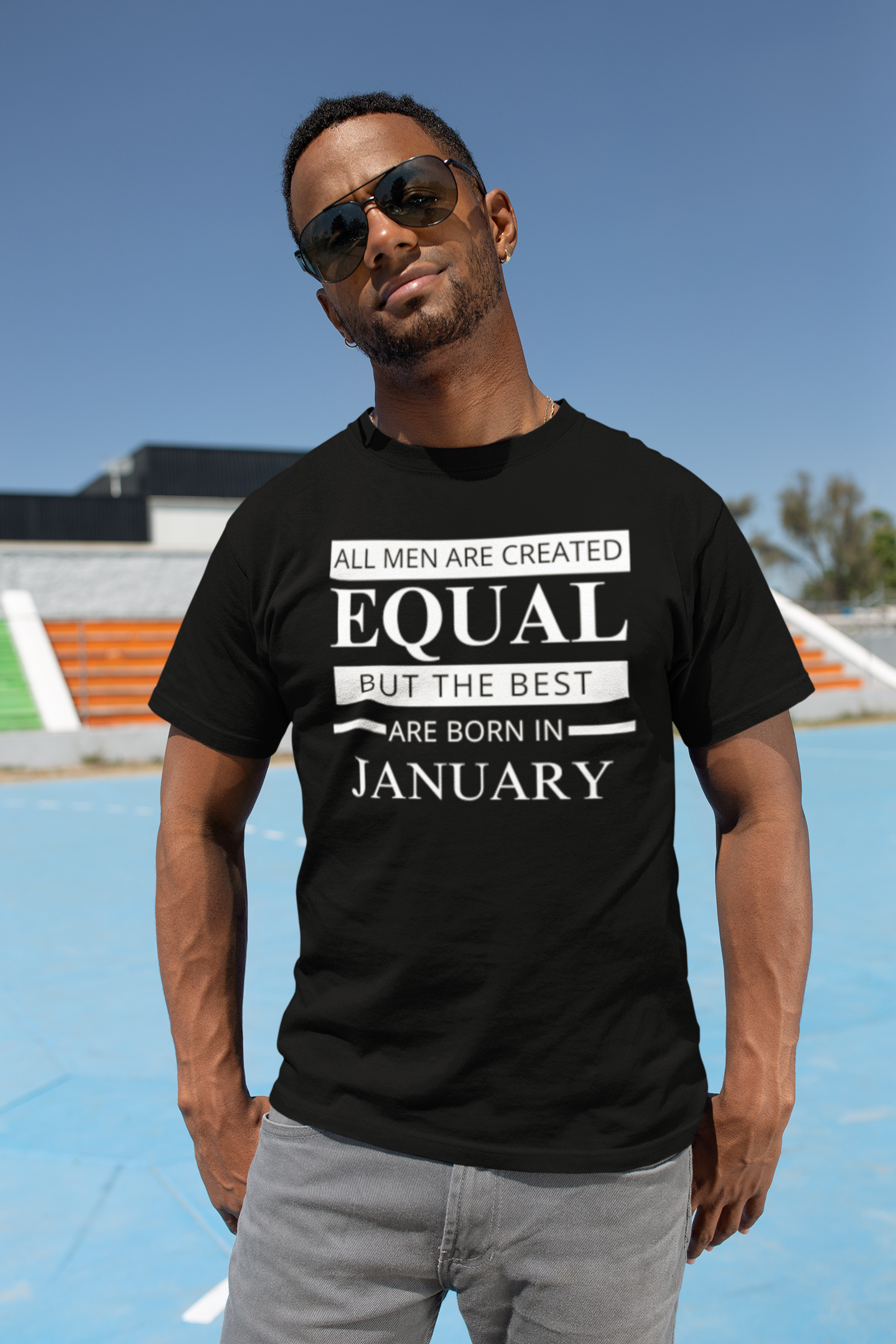 t-shirt-mockup-of-a-muscled-man-wearing-sunglasses-in-a-sports-field-25933