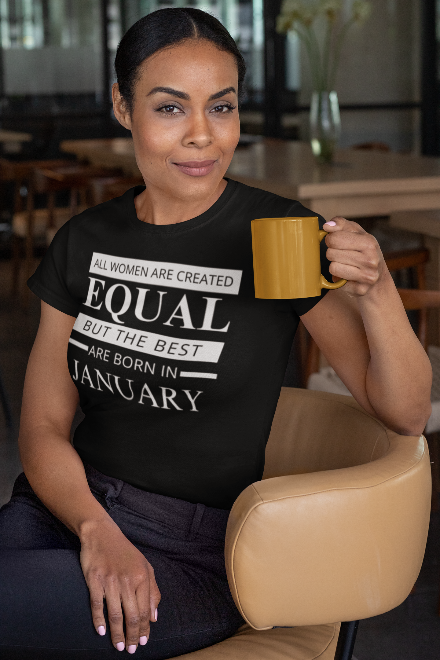 t-shirt-mockup-of-a-woman-sitting-on-a-chair-holding-an-11-oz-coffee-mug-31705