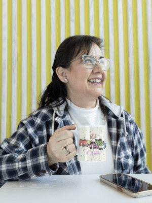 11-oz-coffee-mug-mockup-featuring-a-middle-aged-woman-with-glasses-m24751-1-1