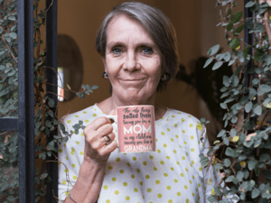 11-oz-coffee-mug-mockup-of-a-lovely-grandma-standing-at-her-window-27440-1