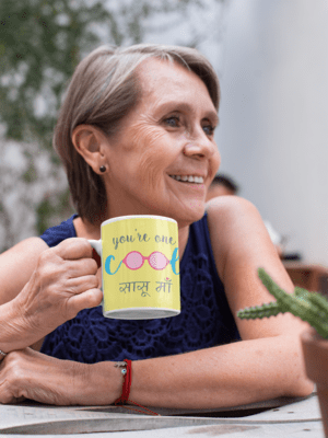 11-oz-mug-mockup-featuring-a-smiling-elderly-woman-at-a-table-27434-2-1