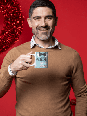 coffee-mug-mockup-featuring-a-middle-aged-man-in-a-christmas-setting-m18350-5