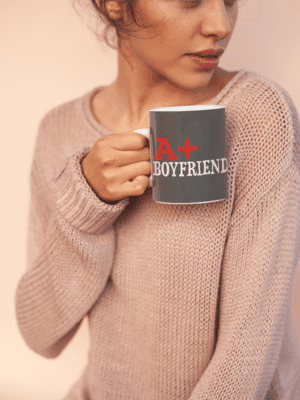 coffee-mug-mockup-held-by-a-woman-wearing-a-cozy-sweater-22441-1