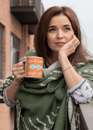 mockup-of-a-middle-aged-woman-holding-an-11-oz-coffee-mug-outside-31600-1