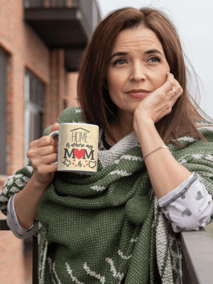 mockup-of-a-middle-aged-woman-holding-an-11-oz-coffee-mug-outside-31600-9-1