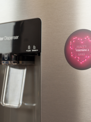 fridge-magnet-mockup-on-a-metallic-fridge-near-the-water-dispenser-a14790